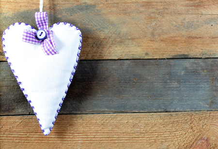 Heart on a wooden background. Background in the style of Valentine's Day. Heart on a wooden backgroundの写真素材