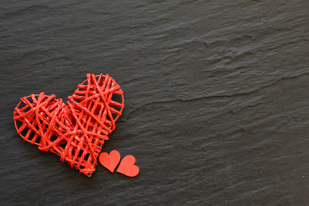 Red hearts on black background. Valentine`s concept background.の写真素材