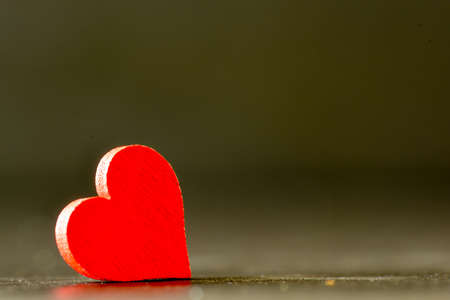 Red heart on black background. Valentine`s concept background.の写真素材
