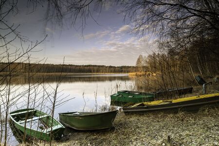 Old wooden boats on the lakeの写真素材