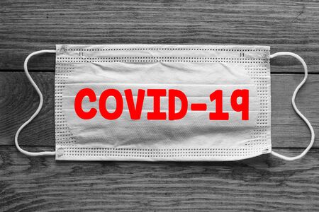 COVID-19 word on protective mask.の写真素材