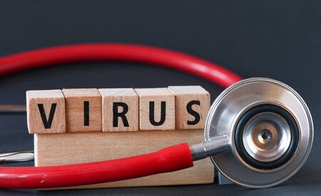 Word virus arranged from wooden letters. Corona virus, mysterious viral pneumonia . Health care and medical conceptの写真素材