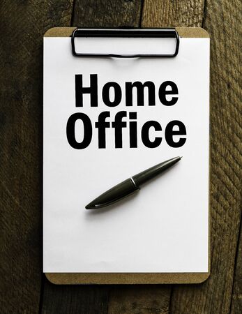 Home office word written on a notebook. Business concept. Time for remote work at home.の写真素材