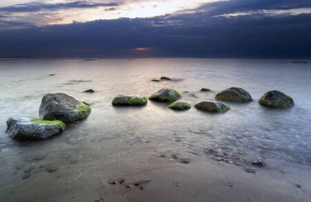 Natural landscape with sea shore on sunset backgroundの写真素材