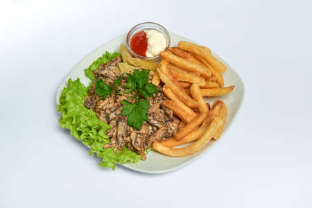 Fried mushrooms in cream with french fries ketchup mayonnaise