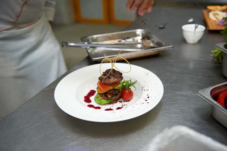 Shish kebab fried with cook vegetables on a plateの写真素材