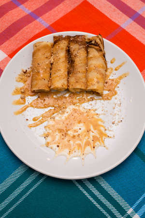 Fried pancakes stuffed with nuts in honey