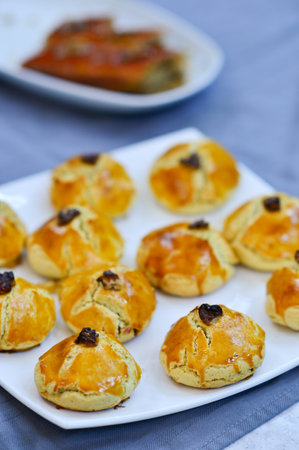 Oven baked pies stuffed with raisins and nuts