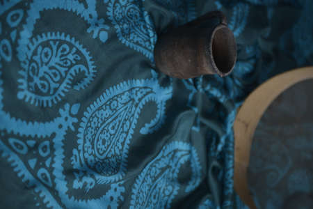 Azerbaijani national national silk scarf called Kelagayi still life with Clay pot and sieve for...