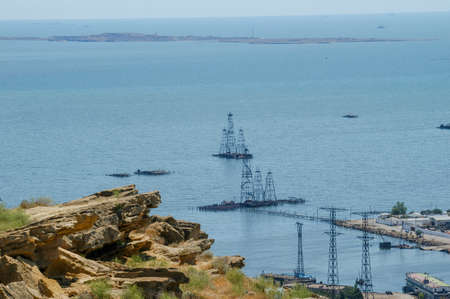 oil rigs on the Caspian Sea against the backdrop of the island