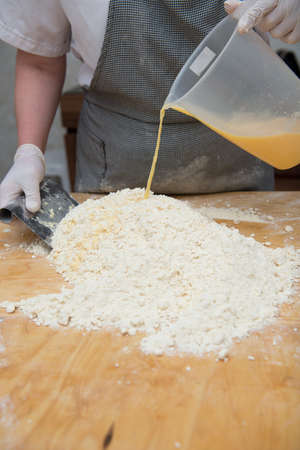 Confectioner chef coocking for baking sweets and pizza hands working momentの写真素材