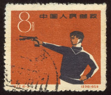 The scanned stamp. The Chinese stamp. The Chinese sportsman shoots at the purpose.のeditorial素材