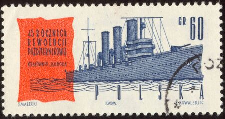 The scanned stamp. The Polish stamp. Cruiser "Aurora" on the river Neva.の写真素材