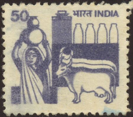 The scanned stamp. The Indian stamp. The woman bears a jug.の写真素材