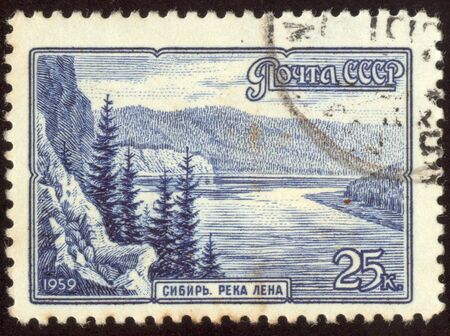 The scanned stamp. The Soviet stamp. The Siberian river in mountains.の写真素材
