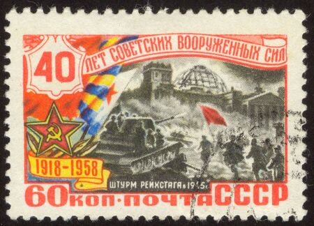 The scanned stamp. The Soviet stamp. Soldiers are at war with the enemy.の写真素材