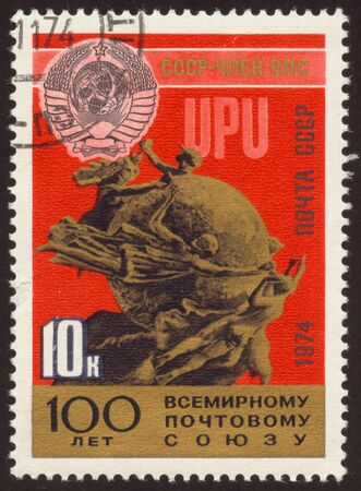 The scanned stamp. The Soviet stamp. Monument on a red background.の写真素材
