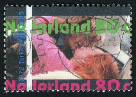 NETHERLANDS - CIRCA 1995: woman and man kissing, circa 1995.のeditorial素材
