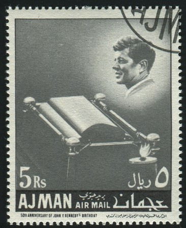AJMAN - CIRCA 1963: stamp printed by Ajman, shows John Fitzgerald Kennedy was the 35th President of the United States, circa 1963.のeditorial素材
