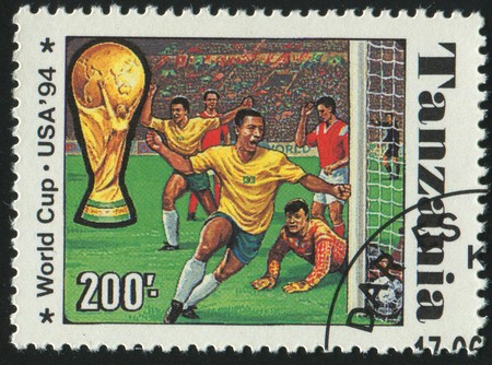 TANZANIA - CIRCA 1994: stamp printed by Tanzania, shows soccer players and ball, circa 1994.のeditorial素材