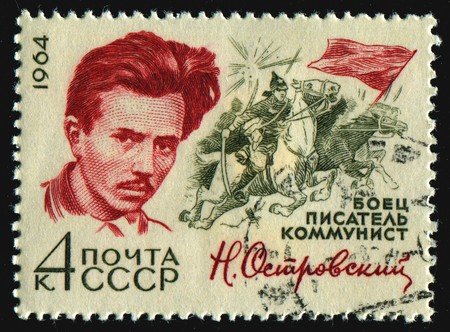 RUSSIA - CIRCA 1964: stamp printed by Russia, shows portrait Nikolai Ostrovsky, circa 1964.のeditorial素材