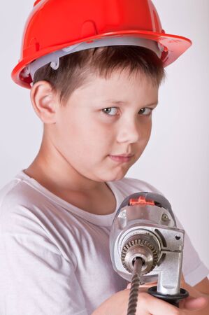 Portrait of a boy in a red protective helmetの写真素材