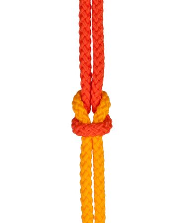 strong knot tied by a rope isolated on a white backgroundの写真素材