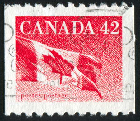 CANADA - CIRCA 1990: stamp printed by Canada, shows Canadian flag, circa 1990の写真素材