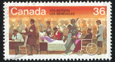 CANADA - CIRCA 1987: stamp printed by Canada, shows Volunteers, circa 1987の写真素材