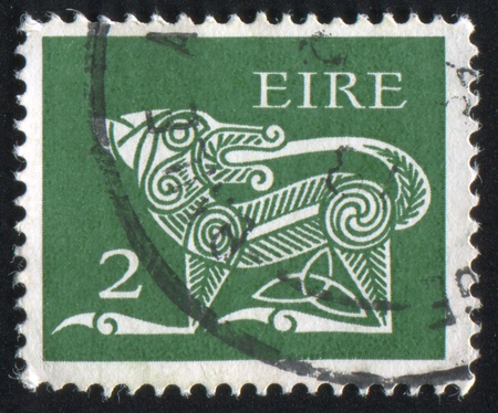 IRELAND - CIRCA 1968: stamp printed by Ireland, shows Dog from Ancient, circa 1968の写真素材