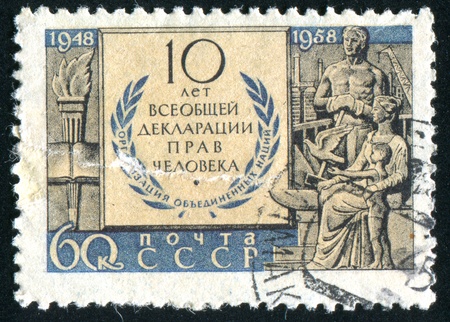 RUSSIA - CIRCA 1958: stamp printed by Russia, shows Torch, Wreath and Family, circa 1958.の写真素材