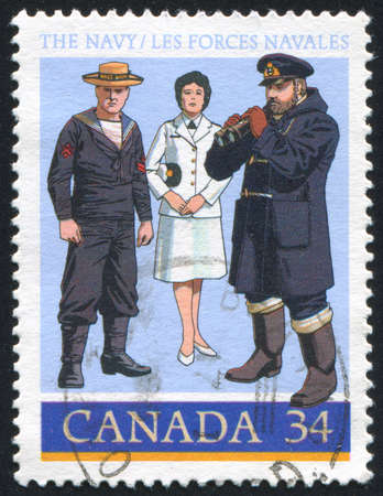 CANADA - CIRCA 1985: stamp printed by Canada, shows 1910 Gunnerï¿½s Mate, World War II Officer, circa 1985の写真素材