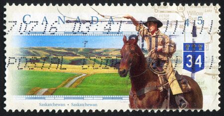 CANADA - CIRCA 1997: stamp printed by Canada, shows cowboy, circa 1997の写真素材