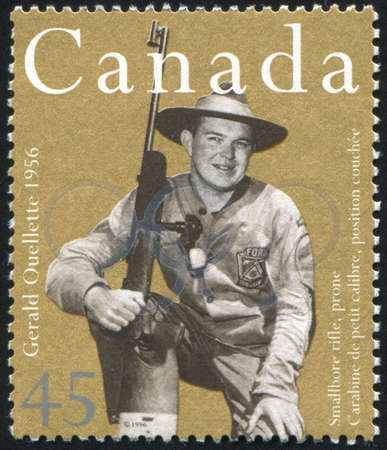 CANADA - CIRCA 1996: stamp printed by Canada, shows Gerald Ouellette, smallbore rifle, prone, circa 1996のeditorial素材