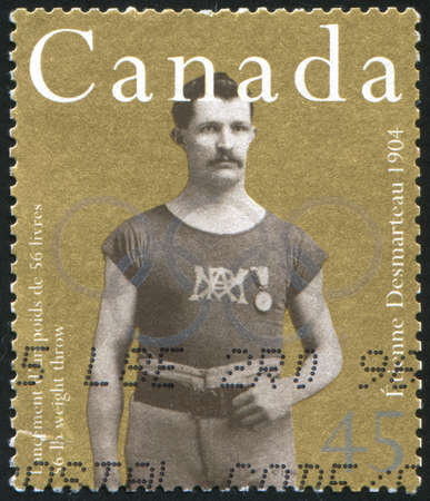 CANADA - CIRCA 1996: stamp printed by Canada, shows Etienne Desmarteau, circa 1996のeditorial素材