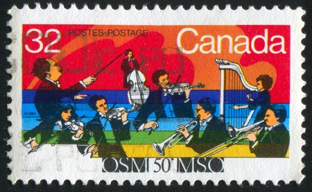 CANADA - CIRCA 1984: stamp printed by Canada, shows 50th Anniv. of Montreal Symphony Orchestra, circa 1984の写真素材