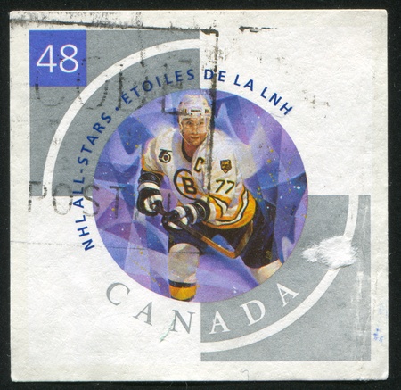 CANADA - CIRCA 2003: stamp printed by Canada, shows hockey player, circa 2003のeditorial素材