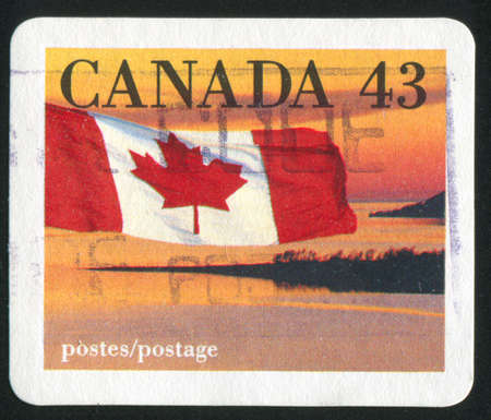 CANADA - CIRCA 1989: stamp printed by Canada, shows Flag and Landscape, circa 1989の写真素材