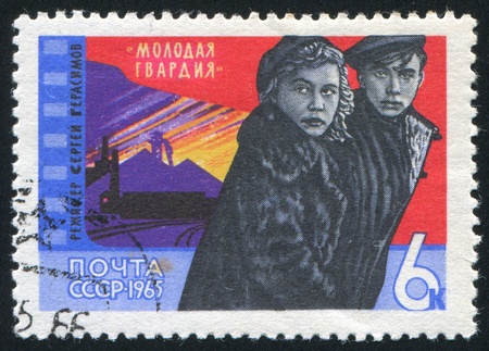 RUSSIA - CIRCA 1965: stamp printed by Russia, shows Film Scenes: Young Guard, circa 1965のeditorial素材