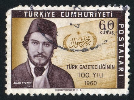 TURKEY - CIRCA 1960: stamp printed by Turkey, shows Agah Efendi and Front Page of Turcamani Ahval, circa 1960.のeditorial素材