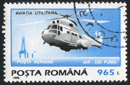 ROMANIA - CIRCA 1995: stamp printed by Romania, show helicopter, circa 1995.の写真素材