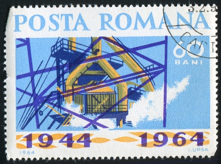 ROMANIA - CIRCA 1964: stamp printed by Romania, shows Factory, circa 1964の写真素材
