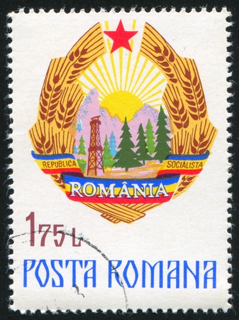 ROMANIA - CIRCA 1976: stamp printed by Romania, shows Coat of Arms, circa 1976の写真素材