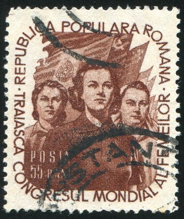 ROMANIA - CIRCA 1953: stamp printed by Romania, shows Women and Flags, circa 1953のeditorial素材