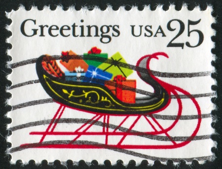 UNITED STATES - CIRCA 1989: stamp printed by United States of America, shows sleigh full of presents, circa 1989の写真素材