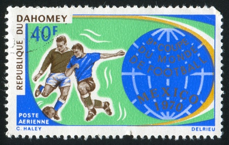 DAHOMEY - CIRCA 1970: stamp printed by Dahomey, shows  Soccer Players and Globe, circa 1970.の写真素材