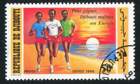 DJIBOUTI - CIRCA 1986: stamp printed by Djibouti, shows runner, circa 1986の写真素材