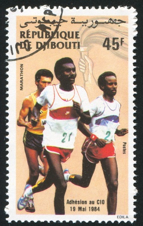 DJIBOUTI - CIRCA 1984: stamp printed by Djibouti, shows runner, circa 1984のeditorial素材