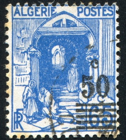 ALGERIA CIRCA 1926: stamp printed by Algeria, shows Street in Kasbah, Algiers, circa 1926の写真素材