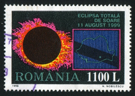 ROMANIA - CIRCA 1998: stamp printed by Romania, shows Total Eclipse of the Sun, 1999, circa 1998の写真素材